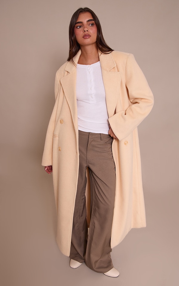 Manteau long structuré en effet laine crème au beurre à double boutonnière