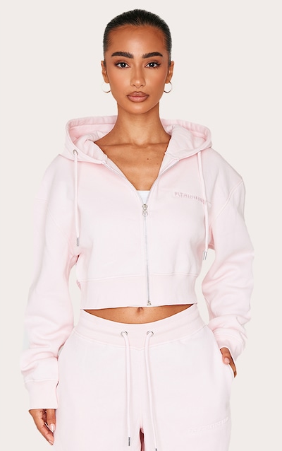 Petite Hoodie court rose tendre à zip et détail en relief