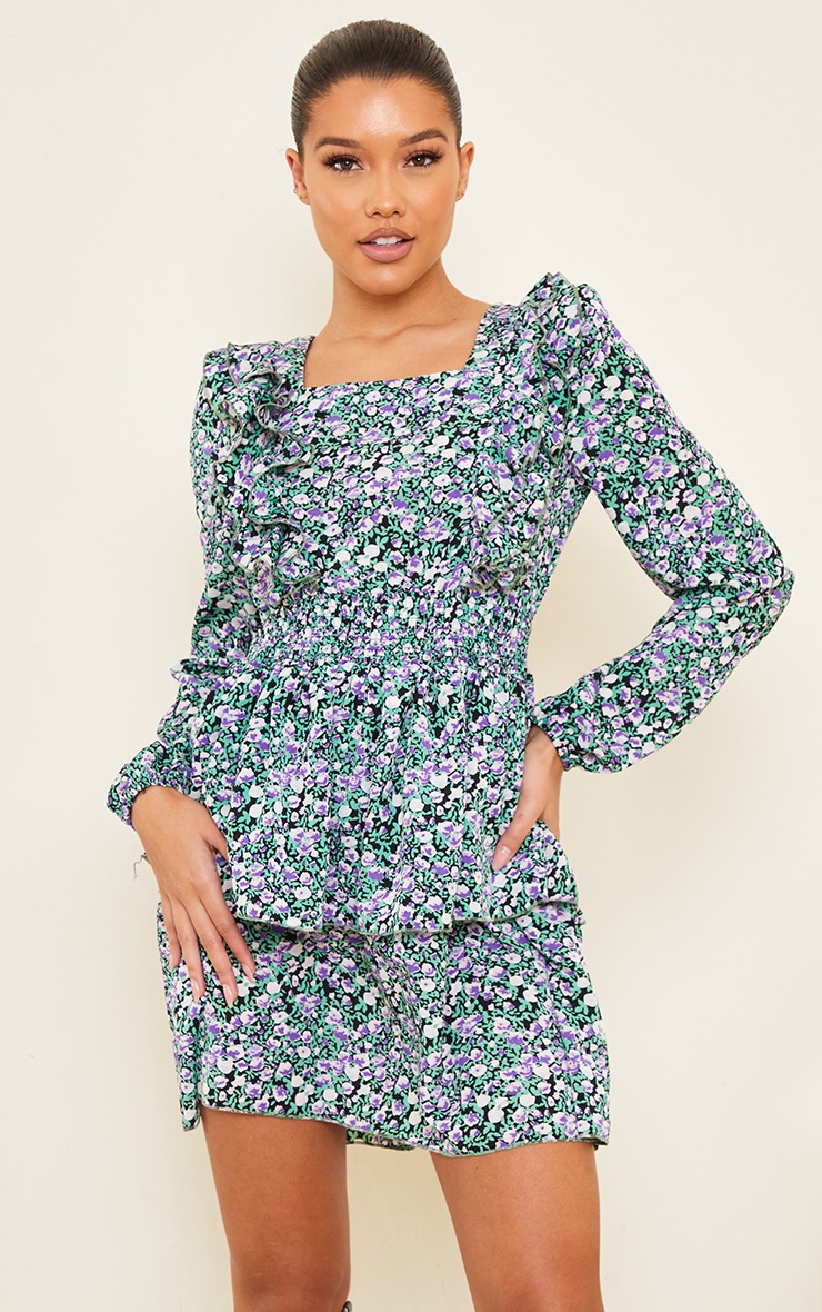 Robe droite noire très volantée à imprimé floral et étage