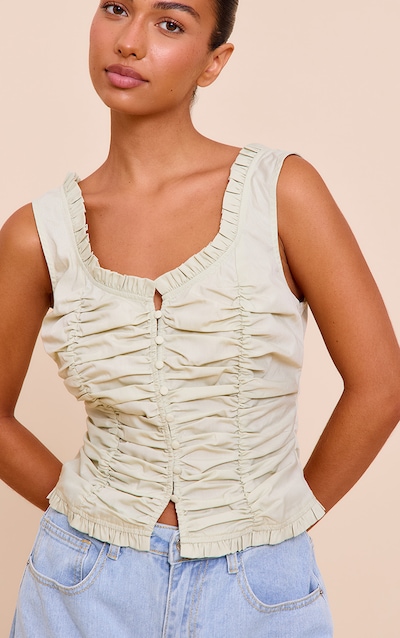 Top ajusté en coton vert menthe froncé devant