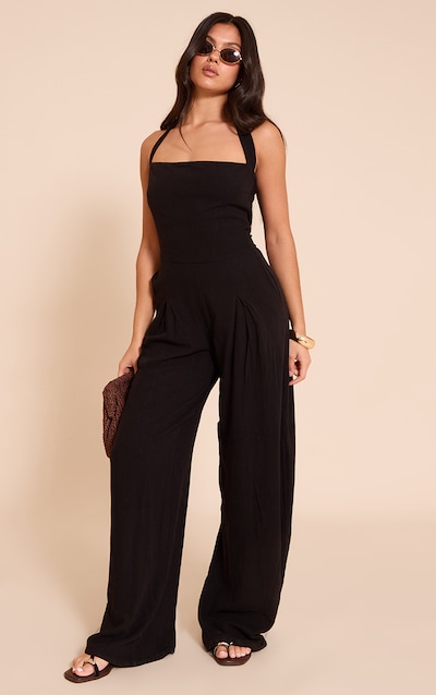 Combinaison large en effet lin noir à dos nu