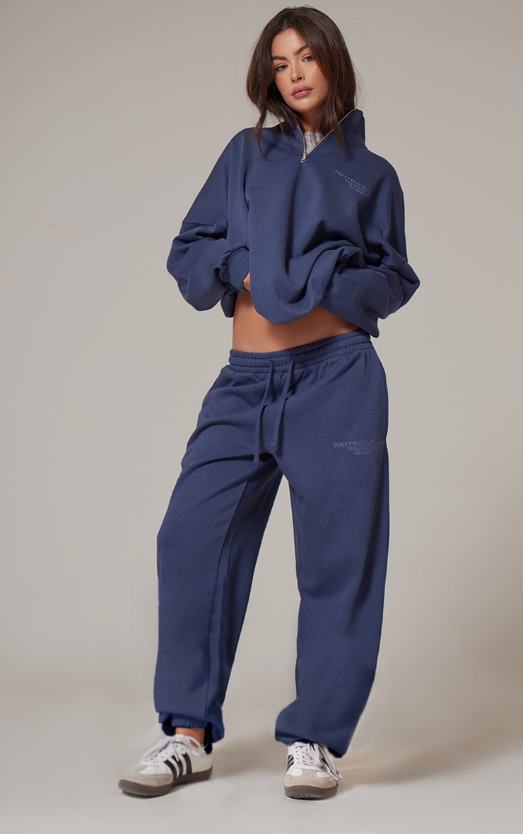 navy blue cuffed track pants