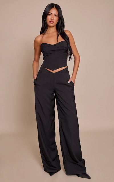 Pantalon de tailleur large noir à taille tombante