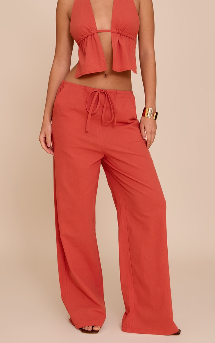 Pantalon large en coton rouille à taille basse et cordons ajustables image 2