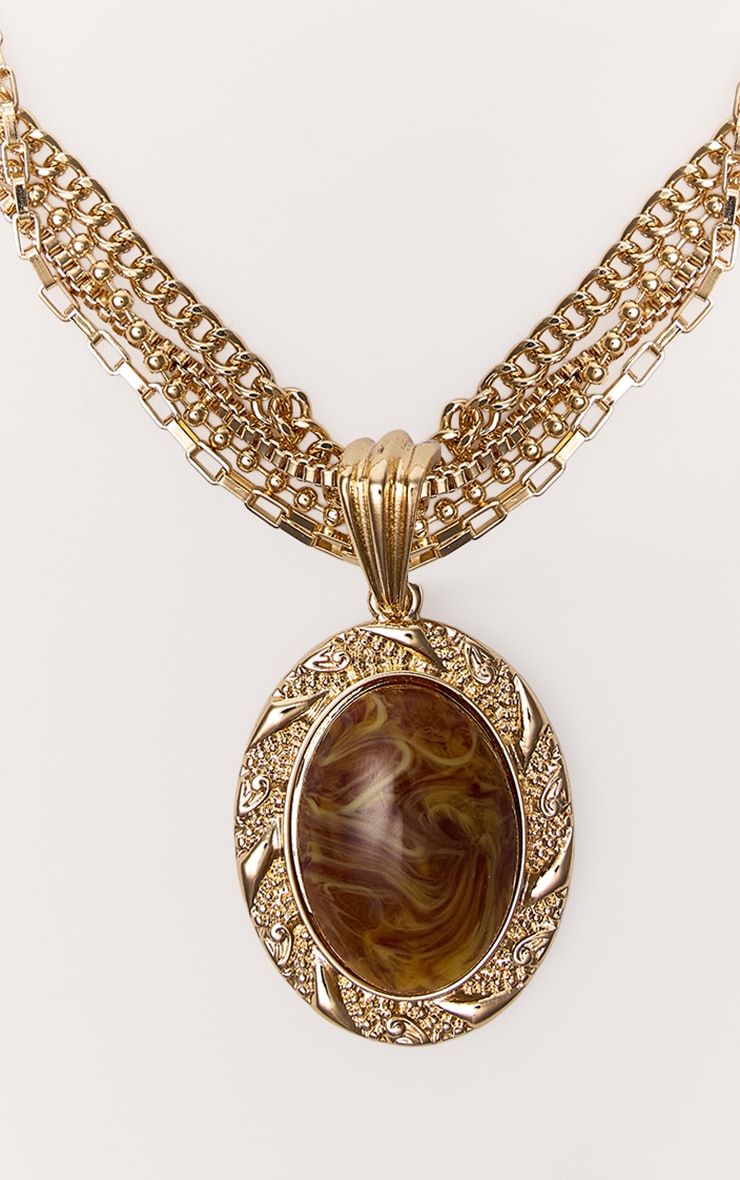 Collier superposé doré à pendentif en résine marron effet fumé image 3