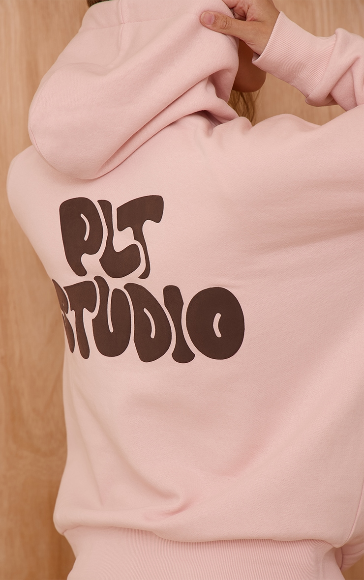 Hoodie oversize rose imprimé "PLT Studio" image 4