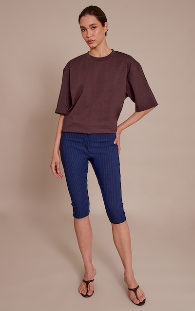 Pantalon capri tissé stretch bleu marine à fines rayures et fermeture cachée