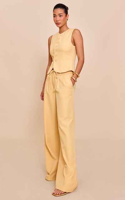 Pantalon de tailleur large tissé jaune beurre à détail noué