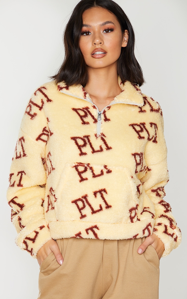 PRETTYLITTLETHING Cream Borg Pocket Half Zip Sweatshirt