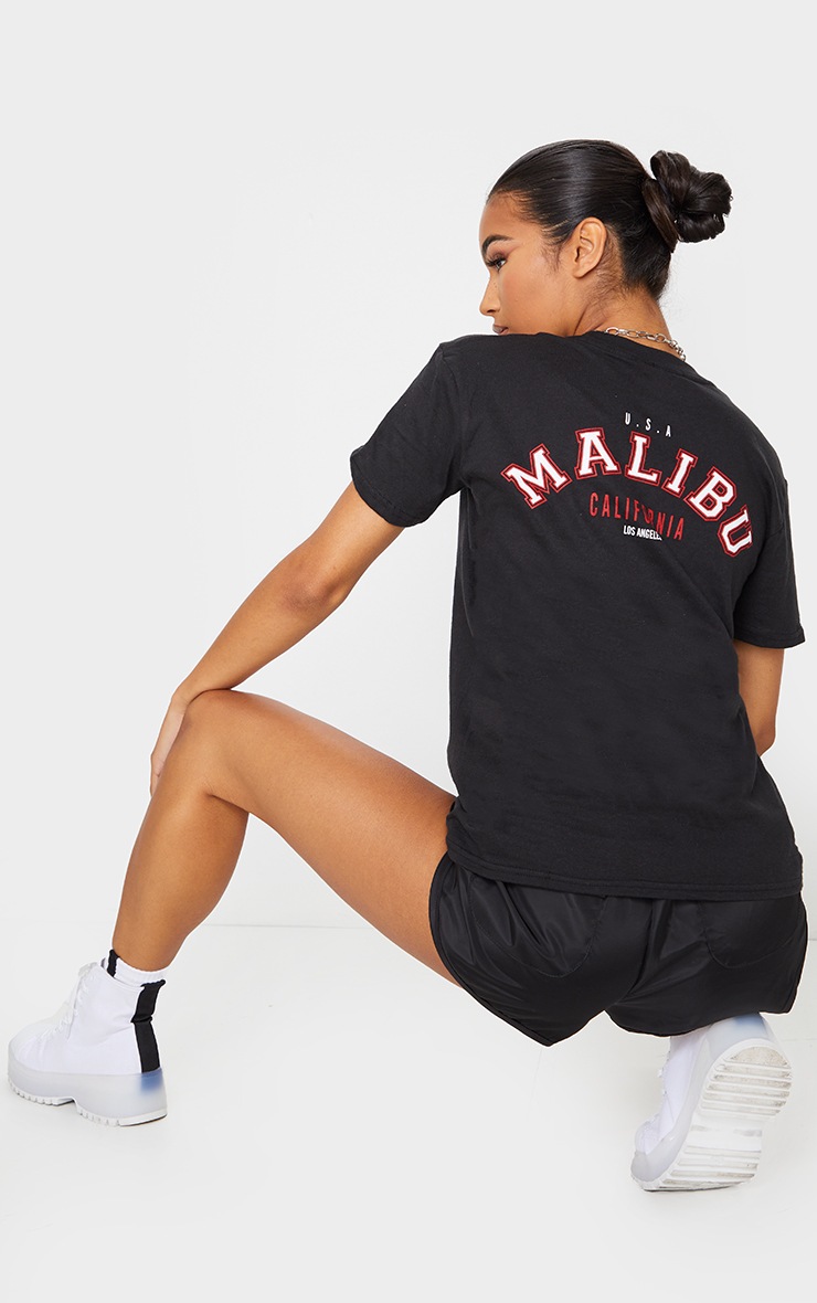 Tee-shirt noir à slogan Malibu au dos