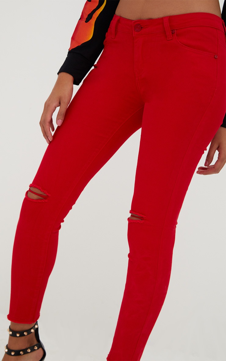 red rip jeans