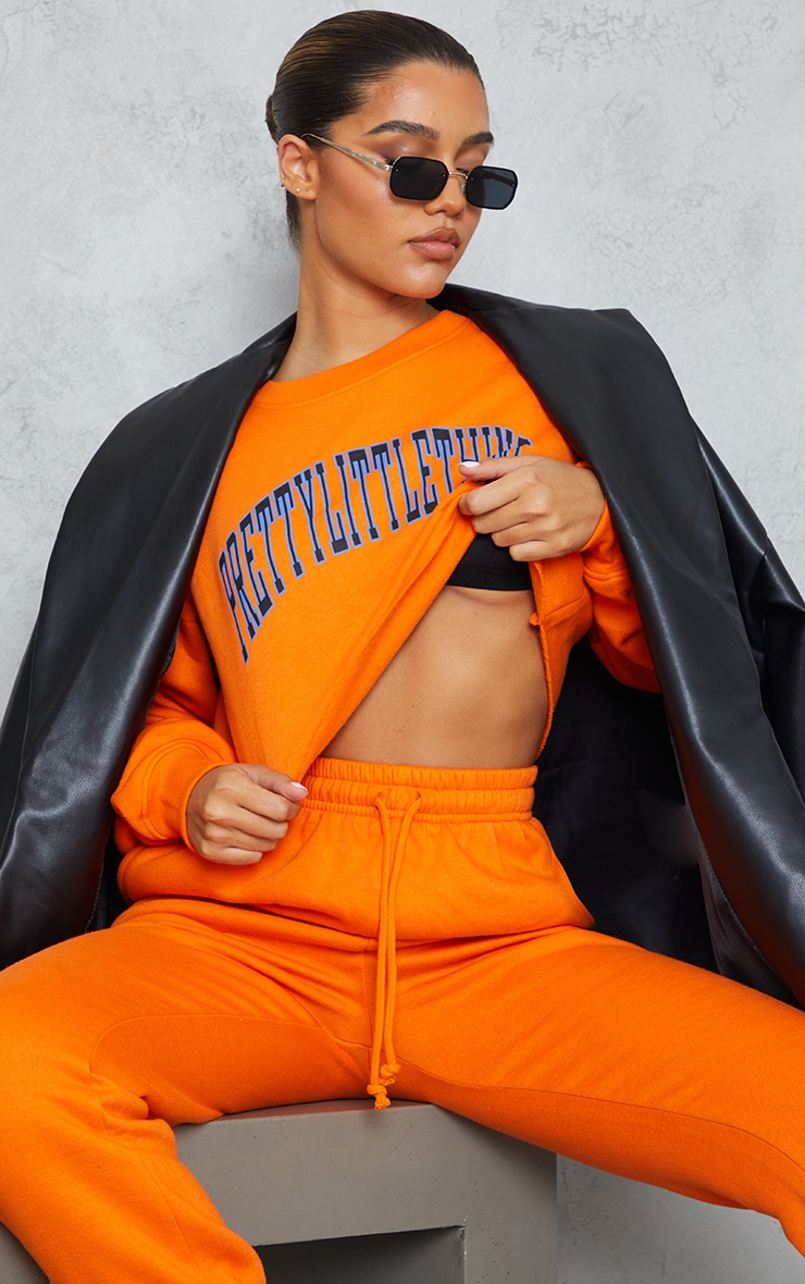 PRETTYLITTLETHING  Bright Orange Official Printed Cropped Sweater image 1