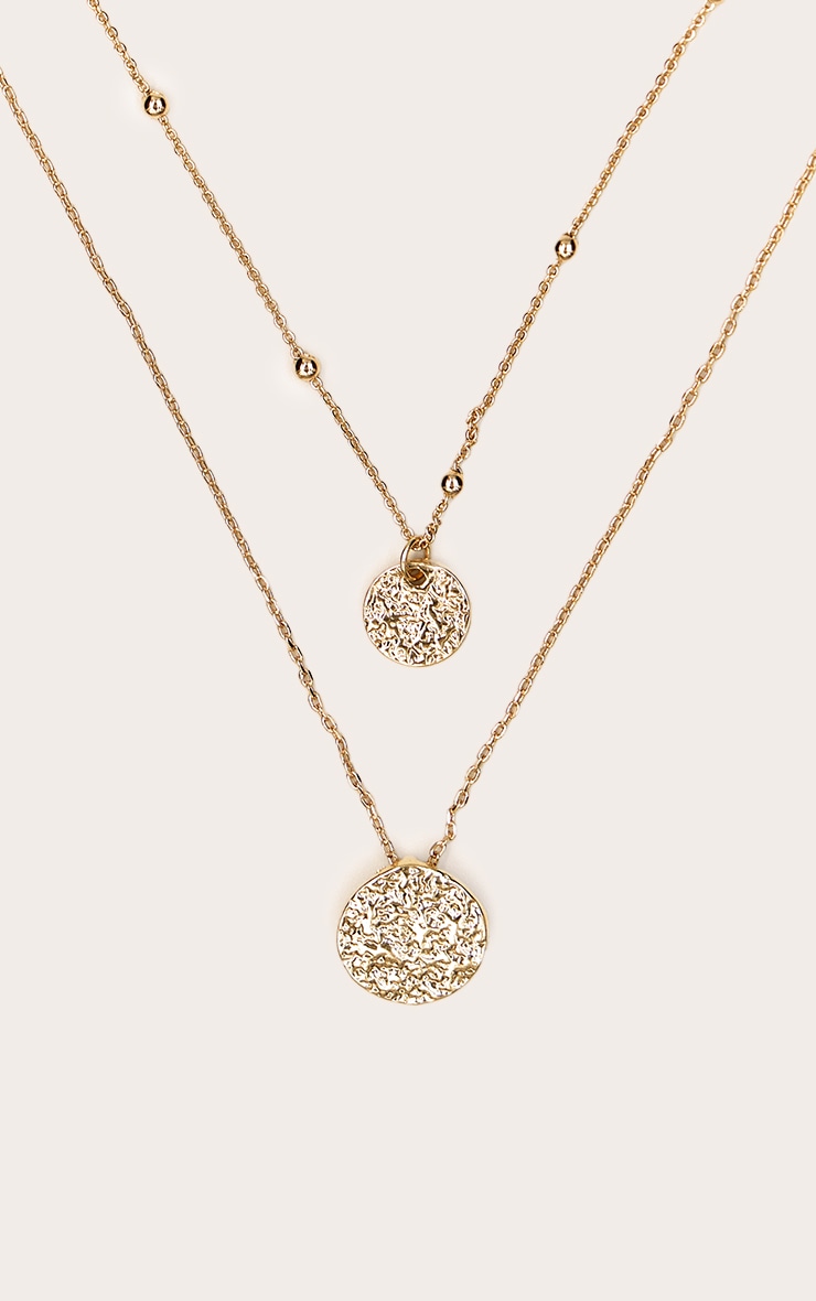 Collier superposé doré à pendentifs en cercles image 3