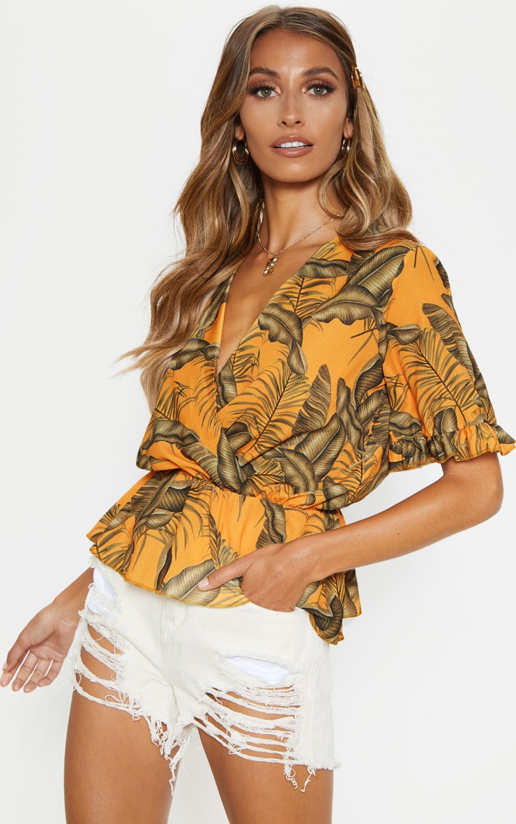 Top décolleté orange en mousseline de soie à manches courtes et imprimé feuilles
