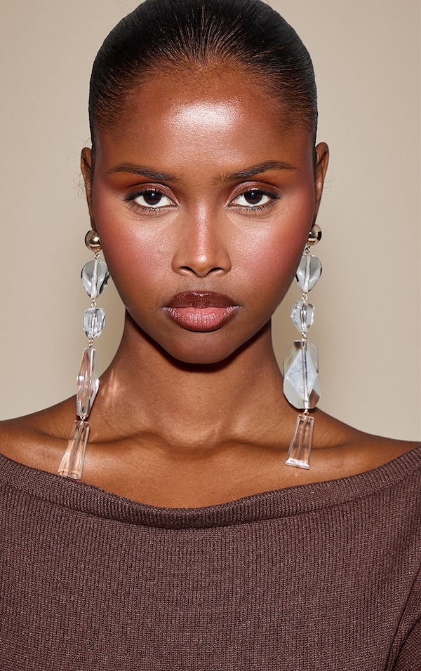 Boucles d'oreilles imposantes tombantes dorées à strass