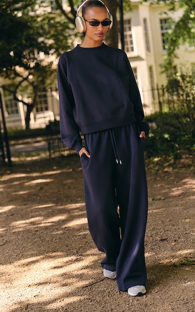 Jogging large tissé bleu marine à logo brodé