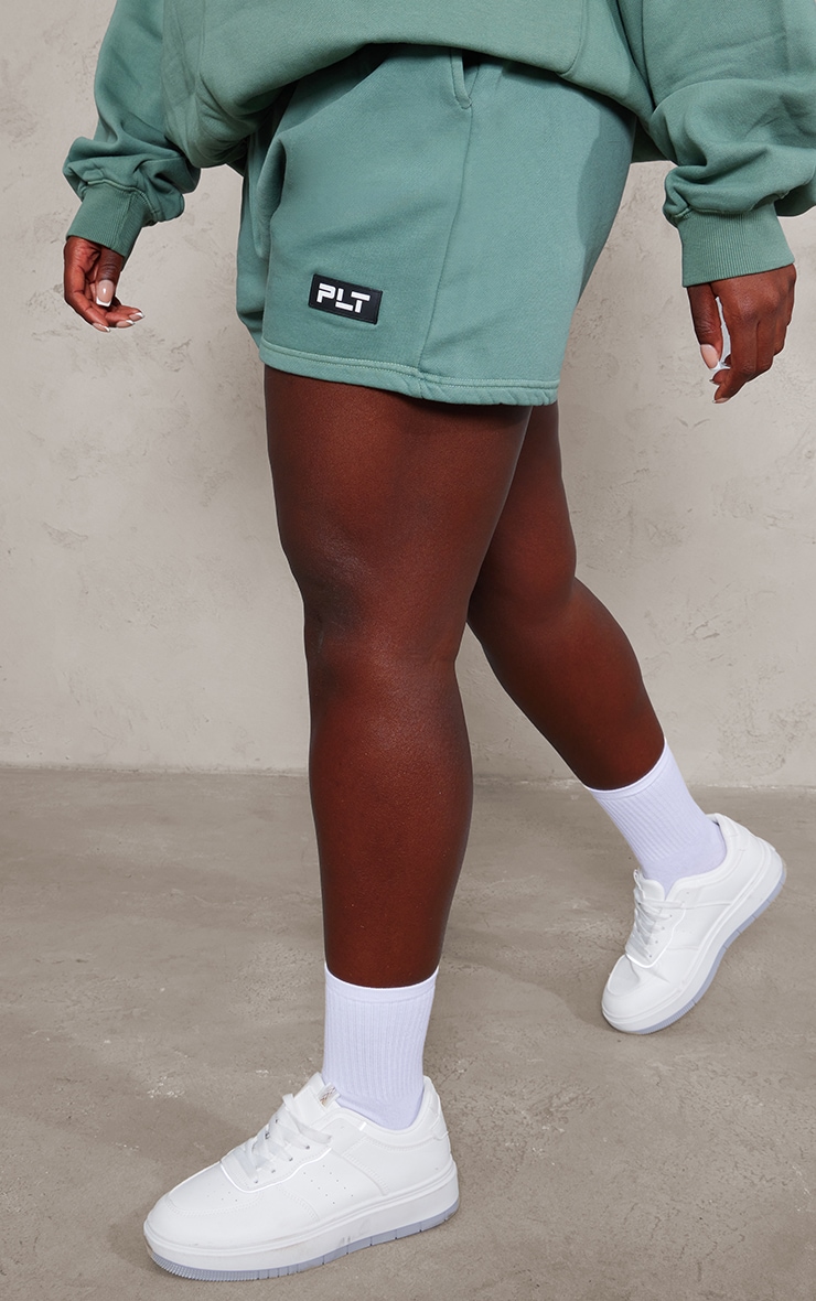 PRETTYLITTLETHING Plus Sage Green Washed Badge Detail Sweat Shorts image 2