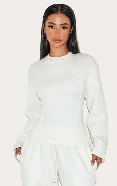 Petite Sweat crème à manches longues et taille cintrée