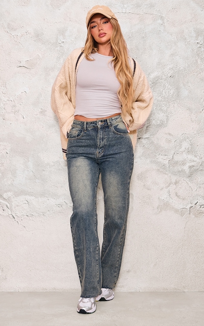 Jean délavé indigo vintage à jambes évasées et ourlets effilochés