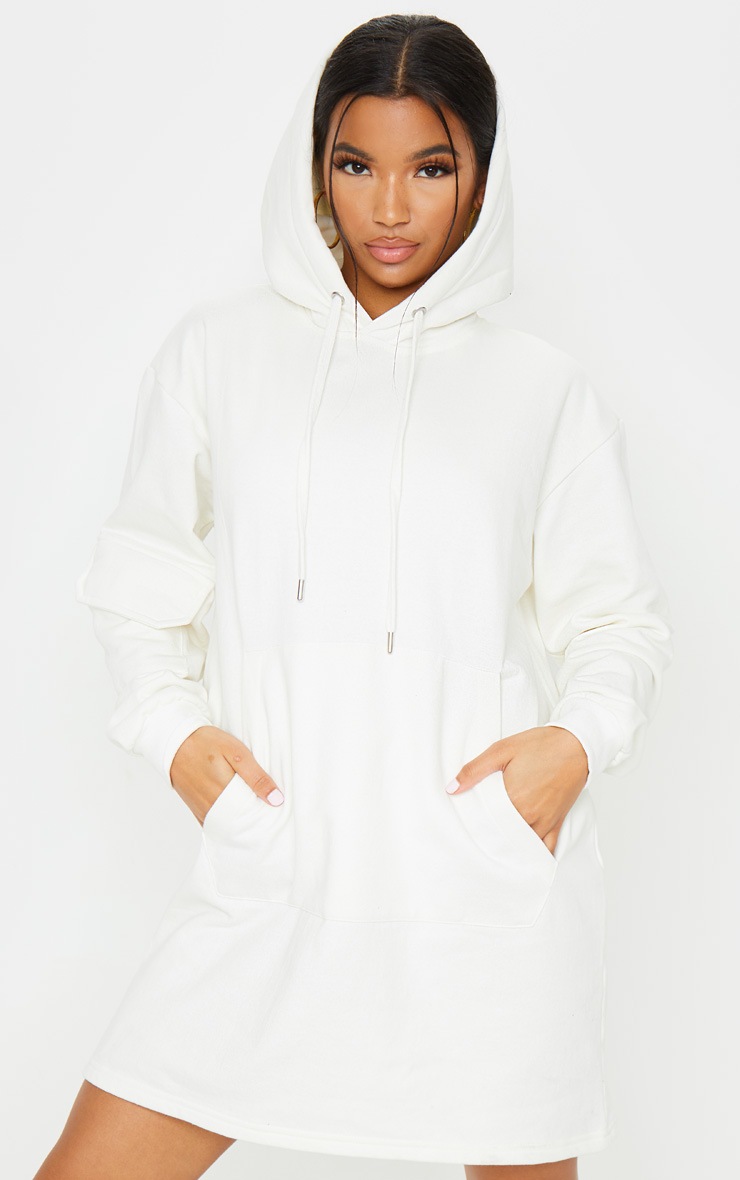 Robe à capuche crème à poche frontale