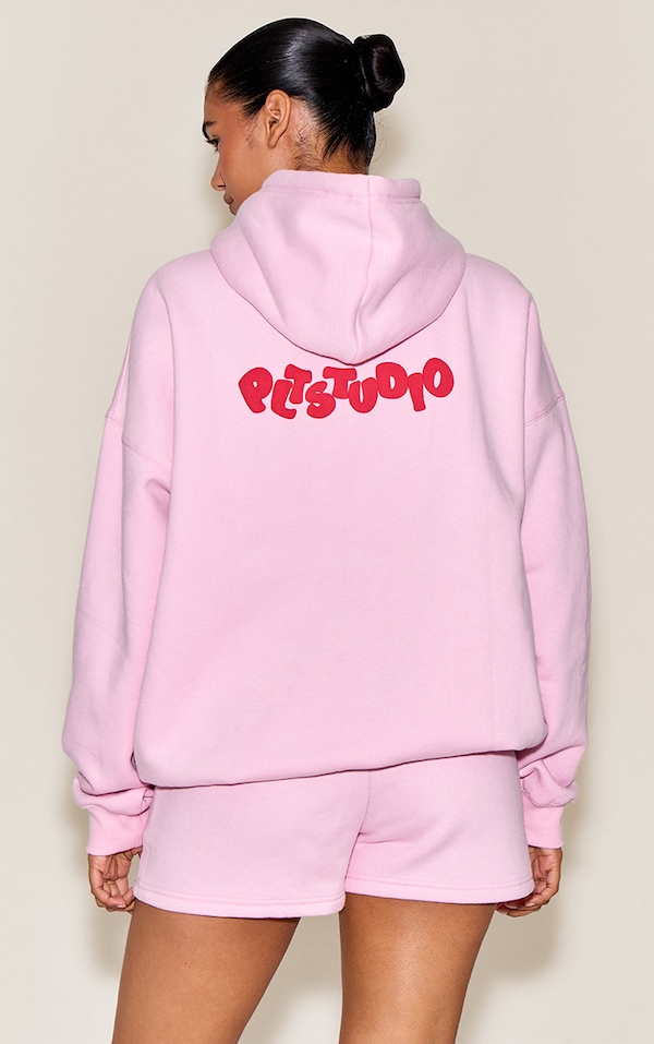 Hoodie oversize rose imprimé boule "PLT Studio"