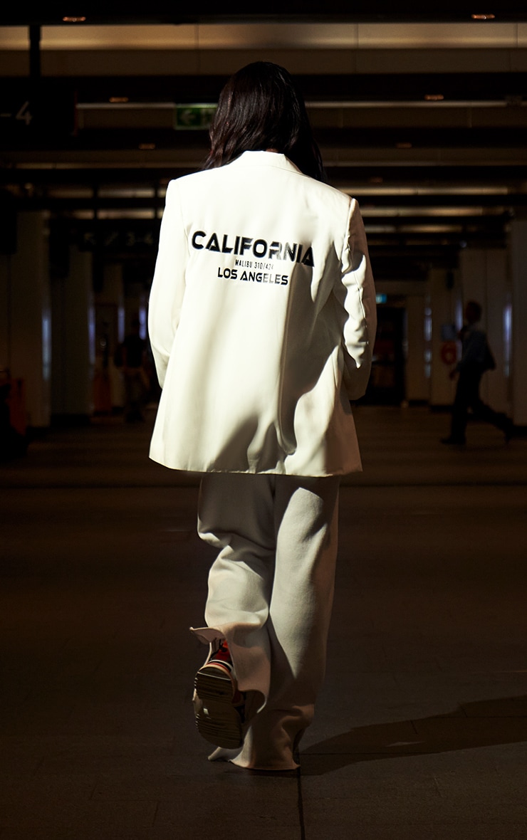 Blazer blanc oversize à slogan au dos