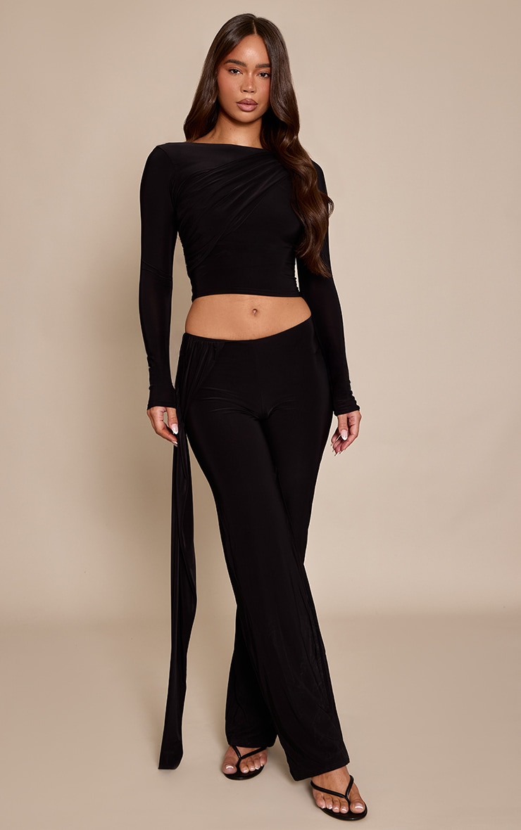 Pantalon droit moulant noir à partie superposée torsadée drapée