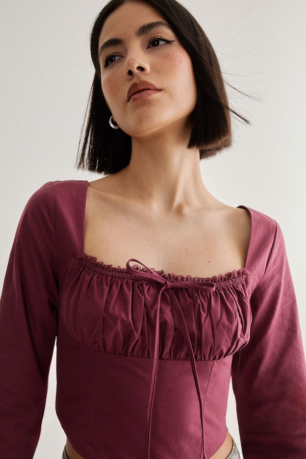 NastyGal Cotton Lace Trim Lace Up Back Long Sleeve Corset Top Wine